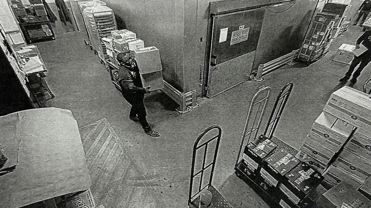 Surveillance image appears to show accused Healey aide Lamar Cook handling packages in a loading area connected to the alleged cocaine scheme, according to investigators.