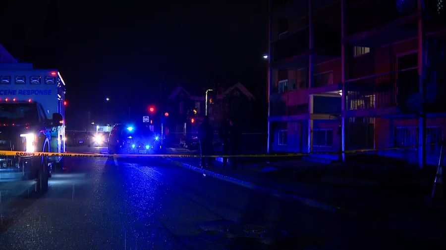 Yellow tape lines the street as Boston police investigate the brutal Mattapan knife killing. (WCVB)
