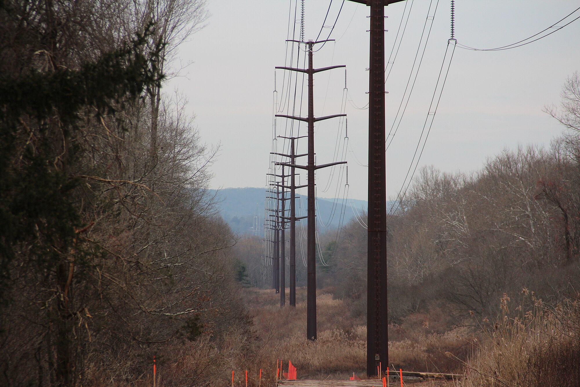 Massachusetts families are paying the price as policy-driven surcharges quietly inflate every electric bill in the state.