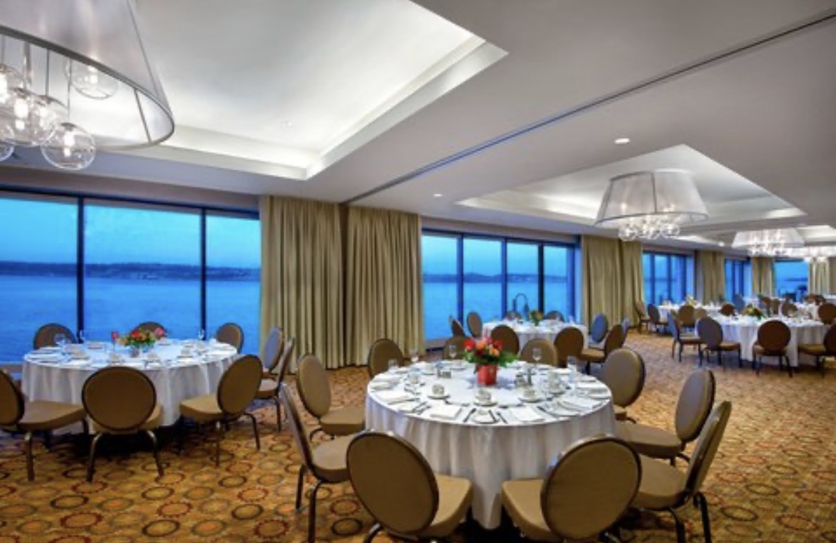 Floor-to-ceiling windows offer sweeping views of Halifax Harbour as guests dine in the Marriott’s elegant waterfront ballroom.