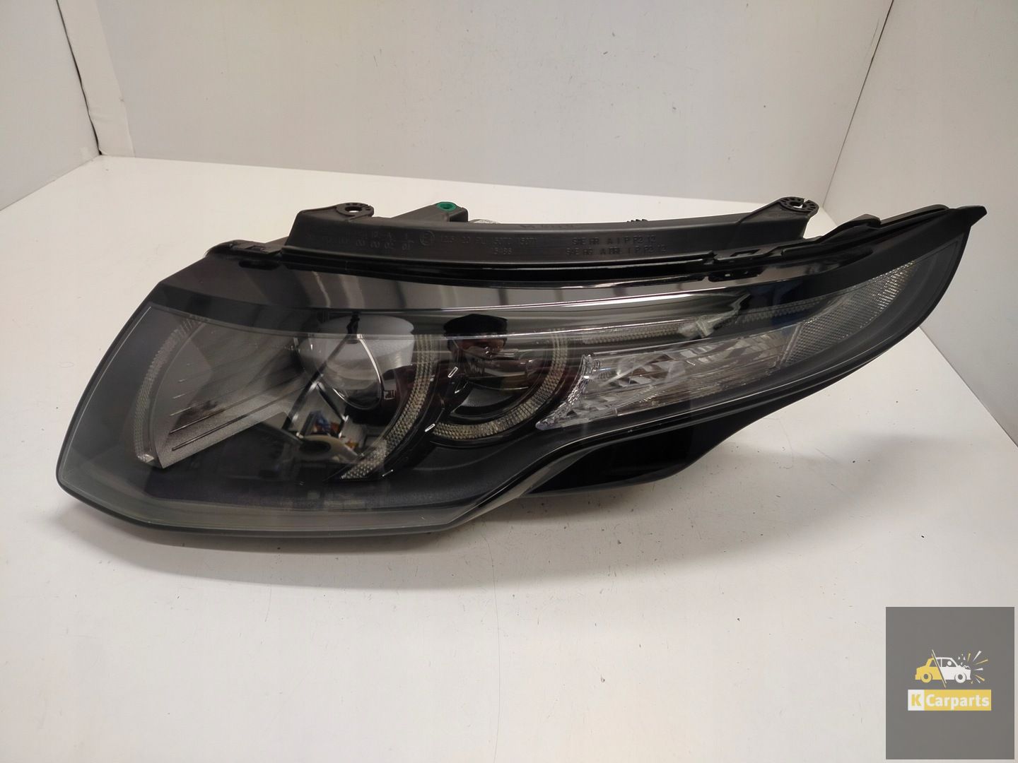 DJ3M-13W030-ED, Range Rover Evoque I Xenon black 12-pin left light