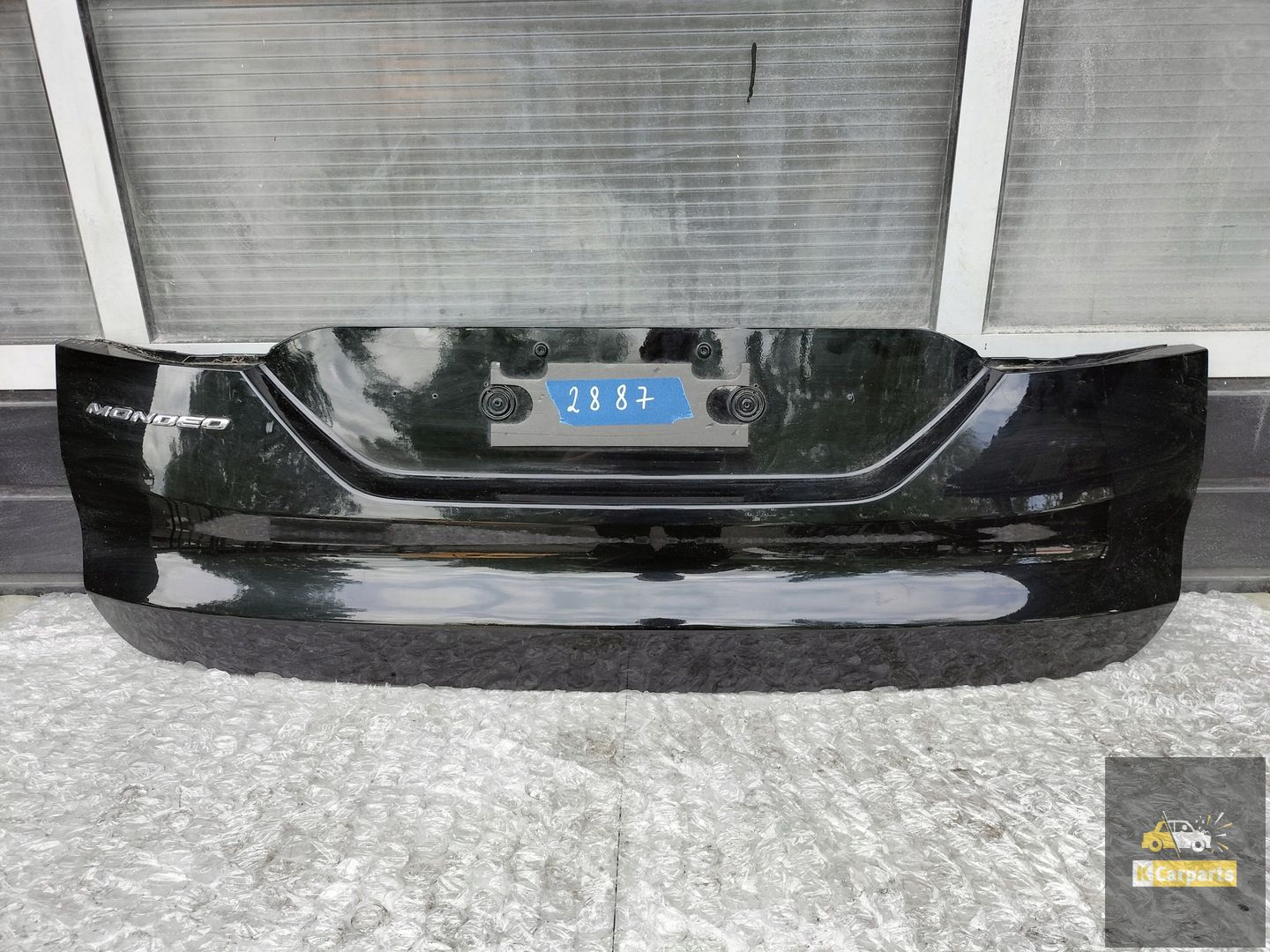 D573N423A40A, FORD MONDEO MK5 AFDEKKING ACHTERKLEP