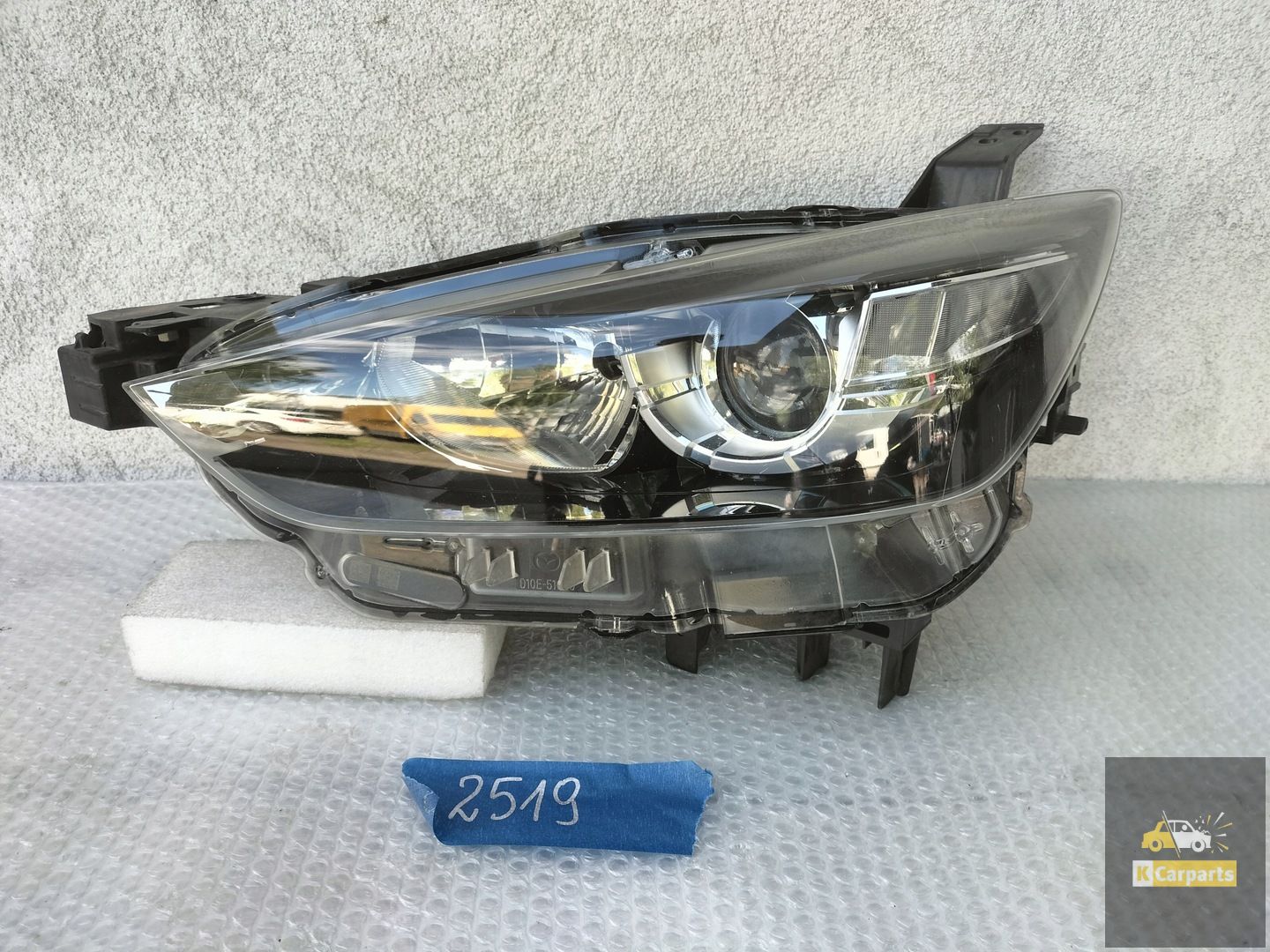 MAZDA CX3 KOPLAMP LINKS D10E51040