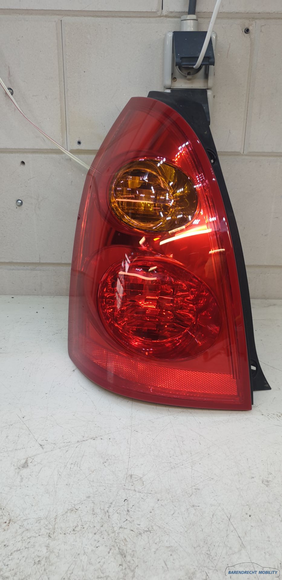 Achterlicht links Primera Nissan stationwagon 26555AU400 bestuurderskant origineel gebruikt 2002 / 2005