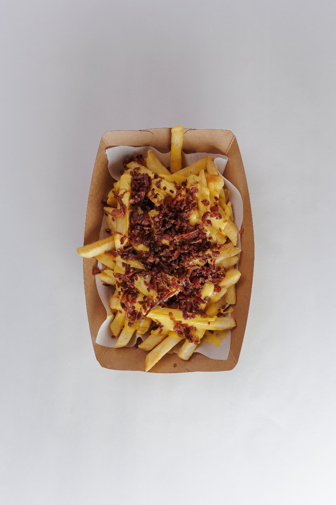 Papas cheddar + bacon