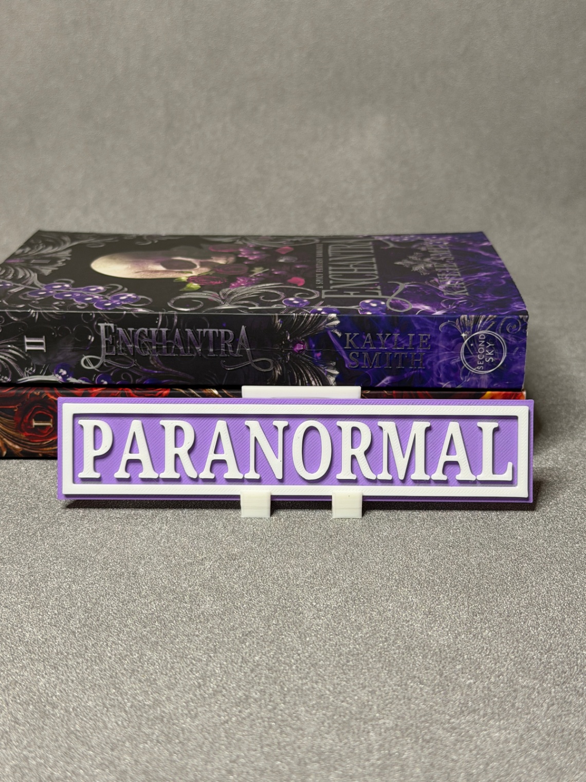 Lentynos ženklas „Paranormal“