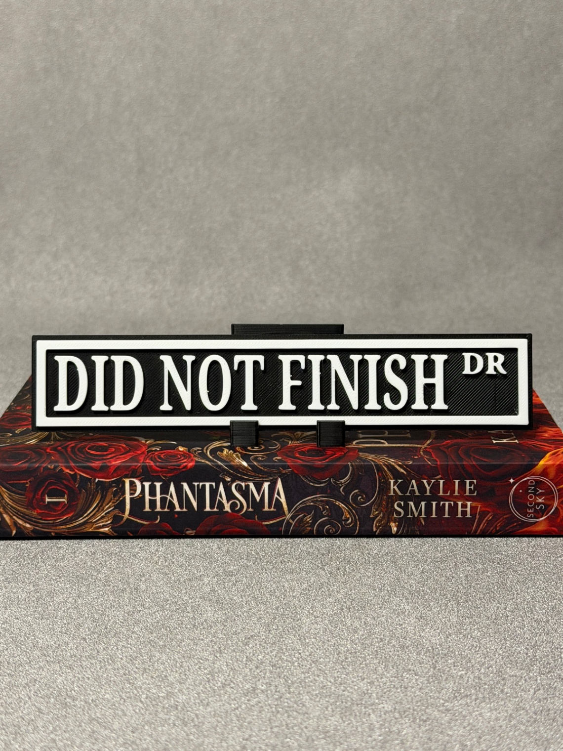 Lentynos ženklas „Did not Finished“