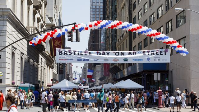 New York, New York, USA - July 10, 2011: The Bastille Day on 60th Street street fair as seen from 5th Avenue looking east across 60th street. This three block long fair celebrates French culture.