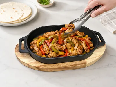 Cast iron skillet with wooden base