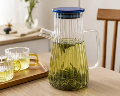 Glass pitcher with colored lid