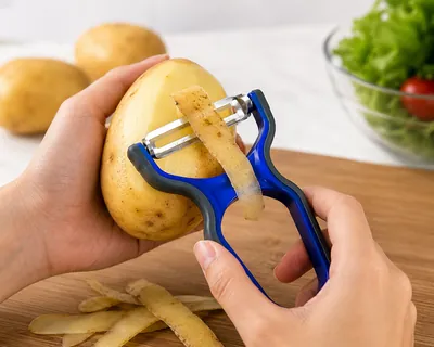 Plastic potato peeler