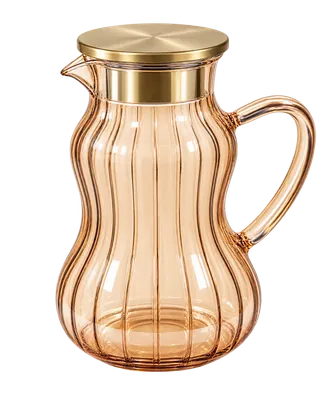 Glass water pitcher with a gold lid