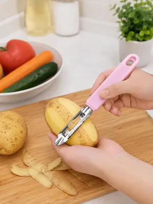 Vegetable peeler with pink handle