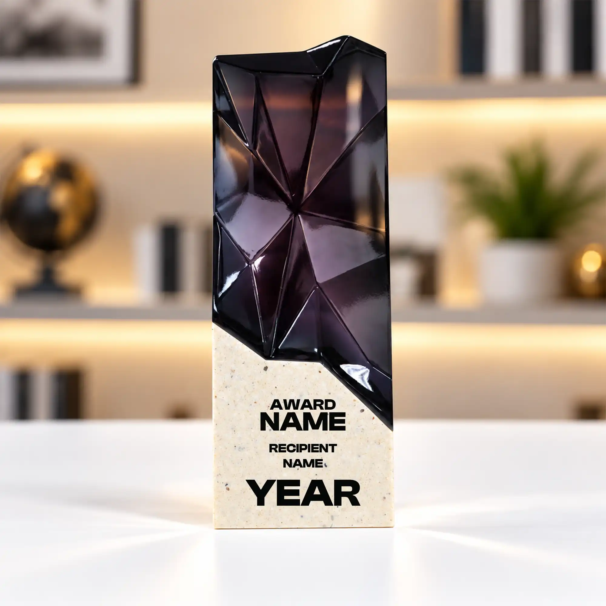 Black faceted prism crystal award on a cream base