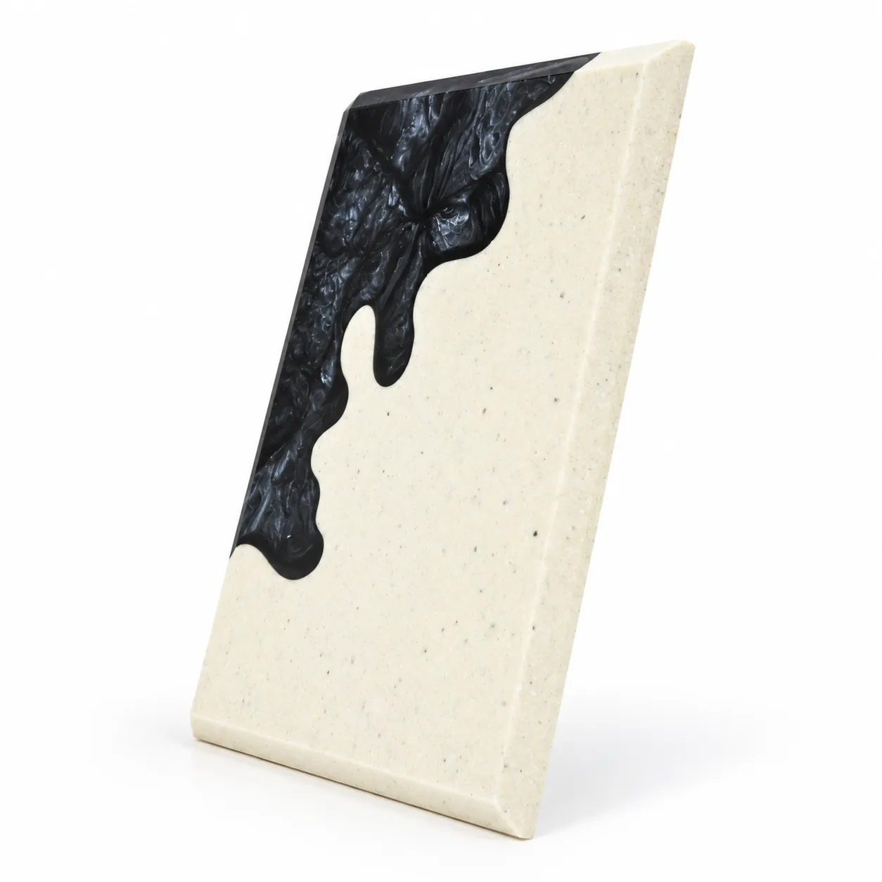 Black abstract crystal award with cream body on a desk