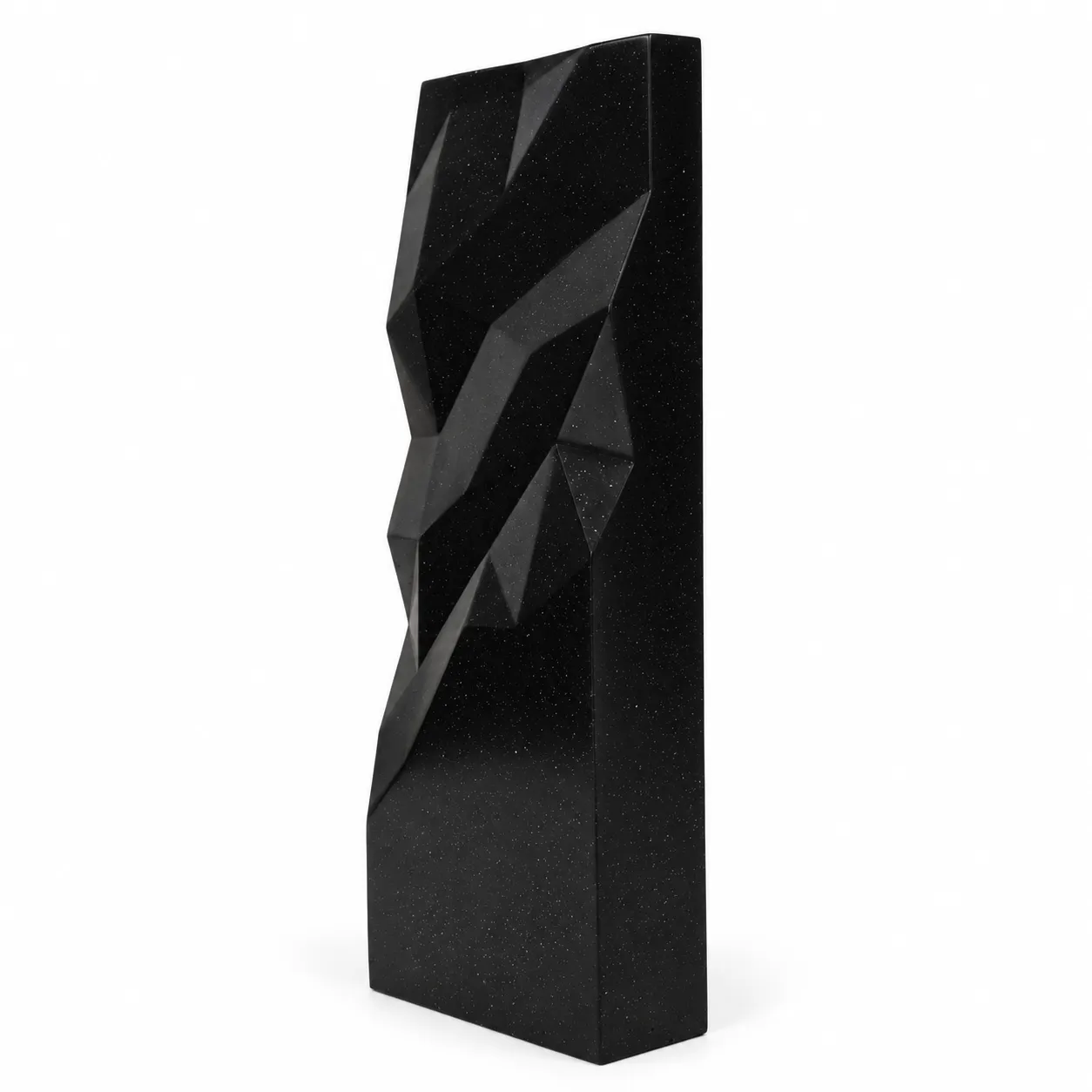 Black geometric faceted crystal award column on a desk