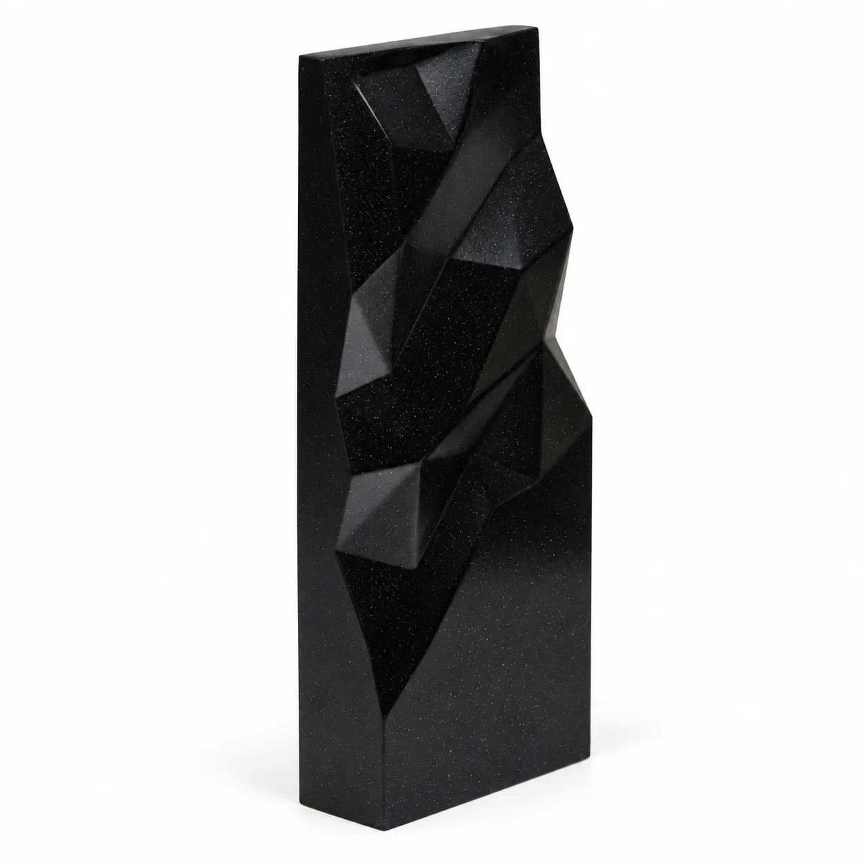 Black geometric faceted crystal award column on a desk