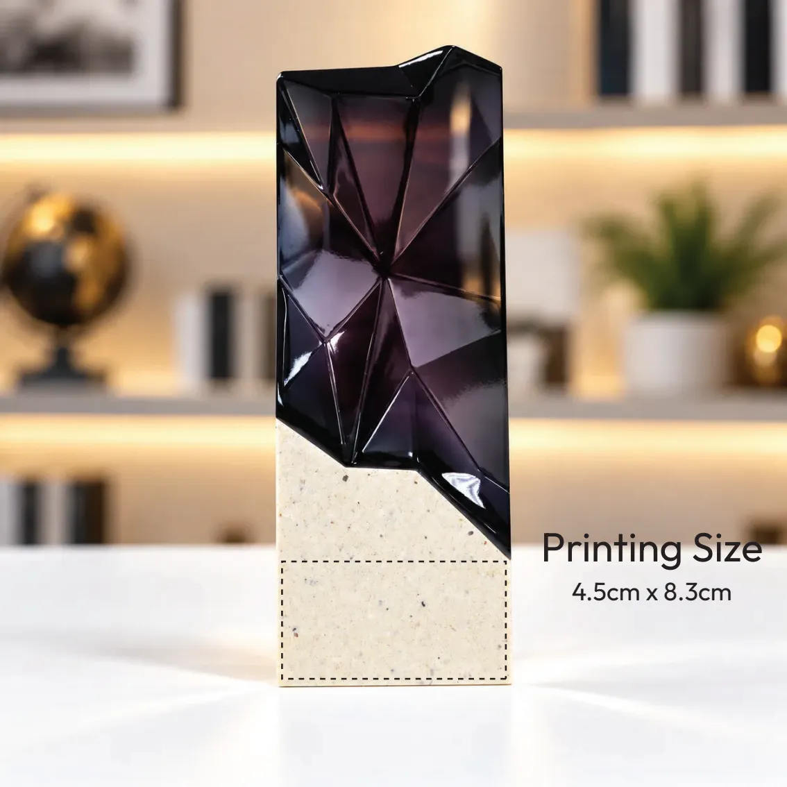 Black faceted prism crystal award on a cream base