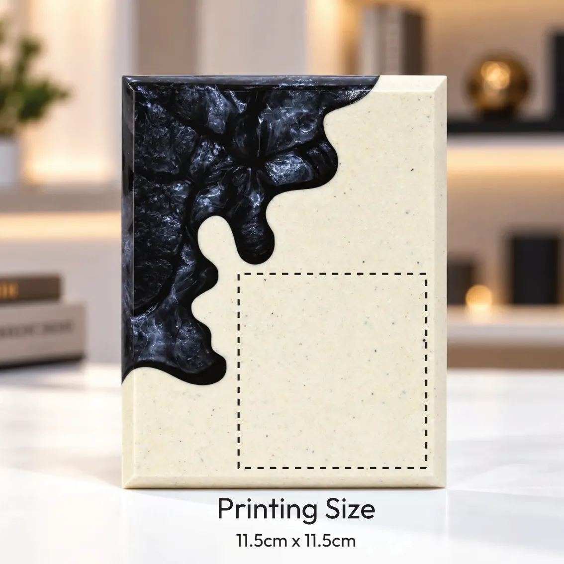 Black abstract crystal award with cream body on a desk