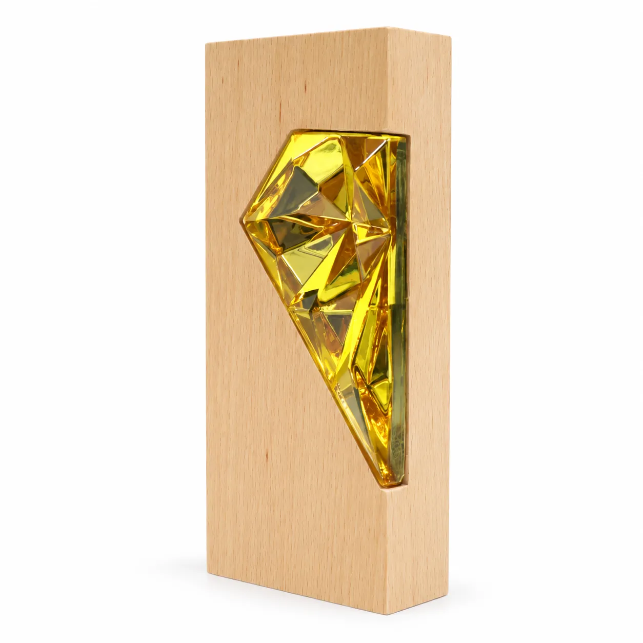 Gold crystal diamond award on wood base, close-up of faceted surface