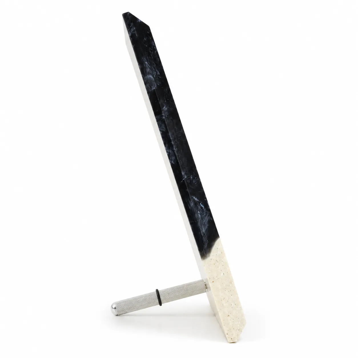 Black abstract crystal award with cream body on a desk