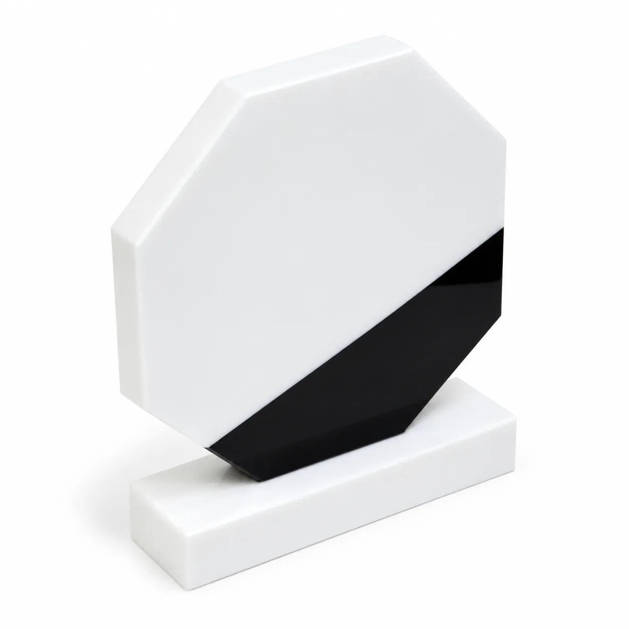 White marble octagonal crystal award on a desk