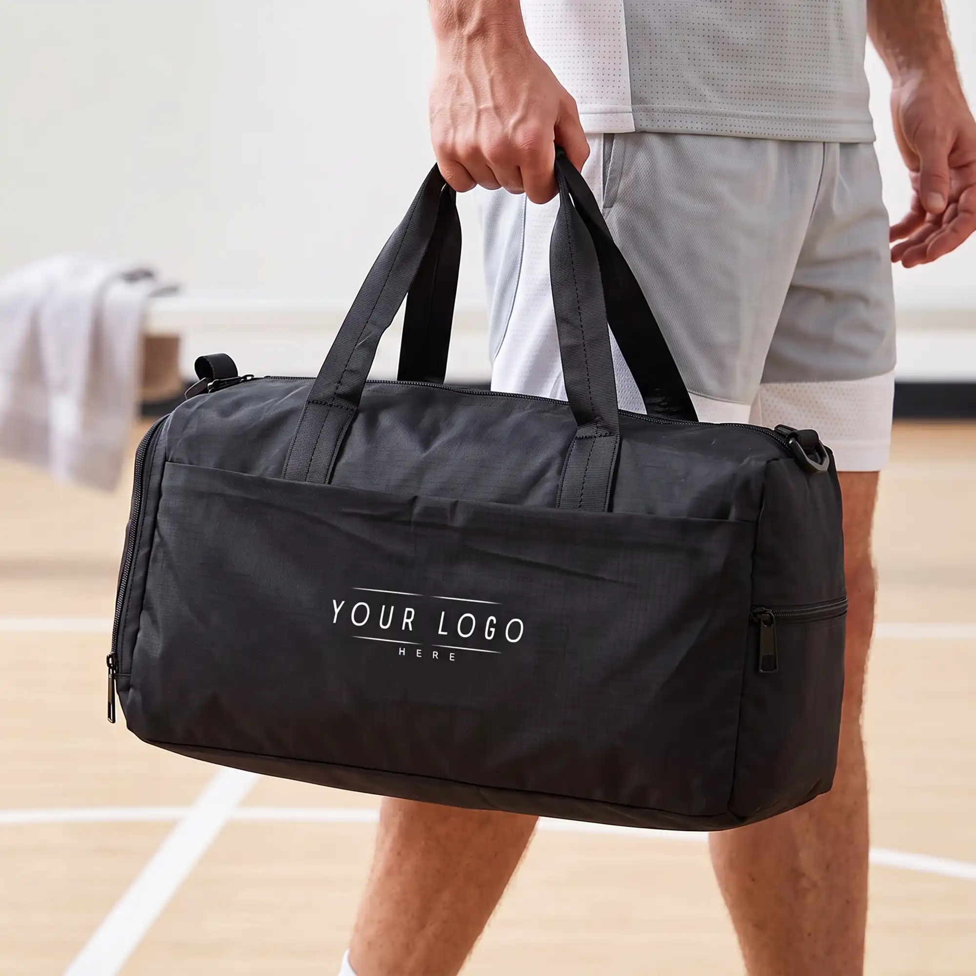 Black executive duffle bag with shoulder strap and spacious compartments for travel