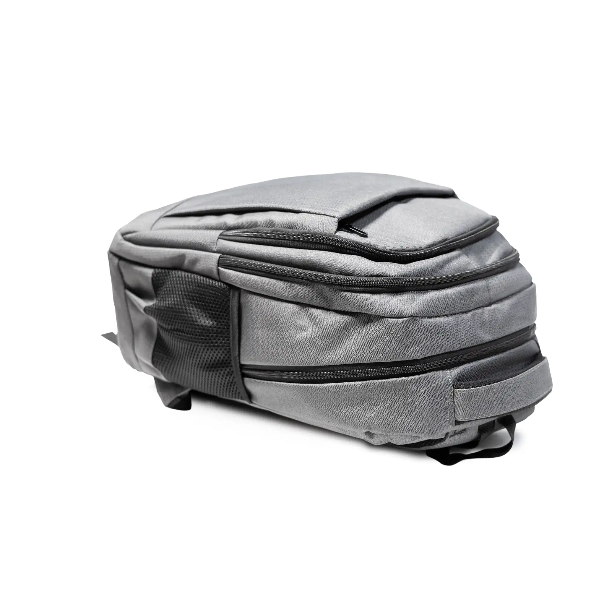 Gray travel backpack with zipper and USB charging feature