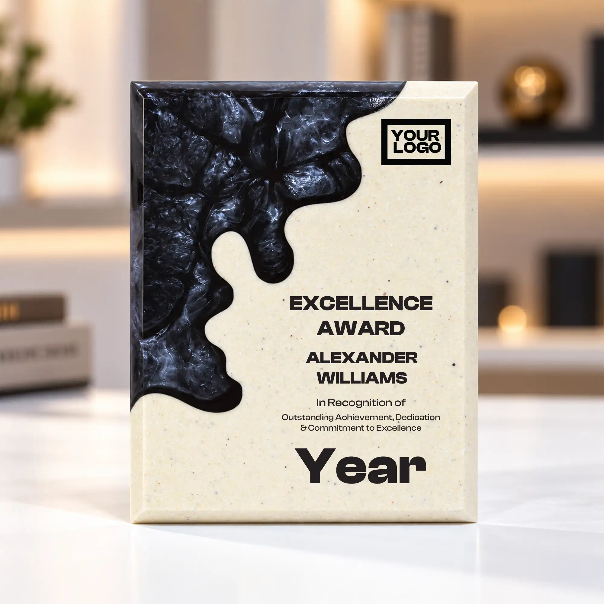Black abstract crystal award with cream body on a desk
