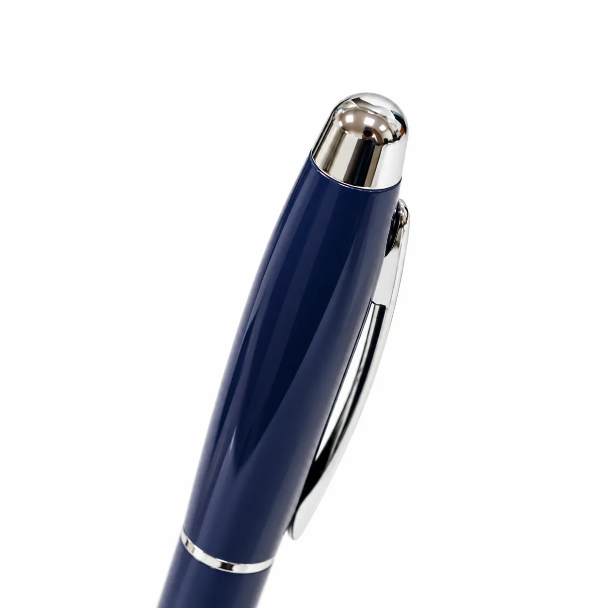 Blue glossy metal ballpoint pen with chrome trim standing upright on white