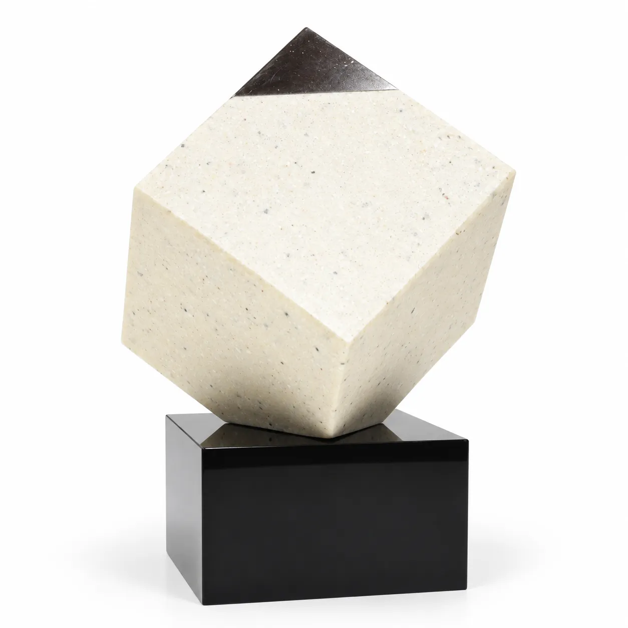 Diamond corner crystal cube on a black base on a desk
