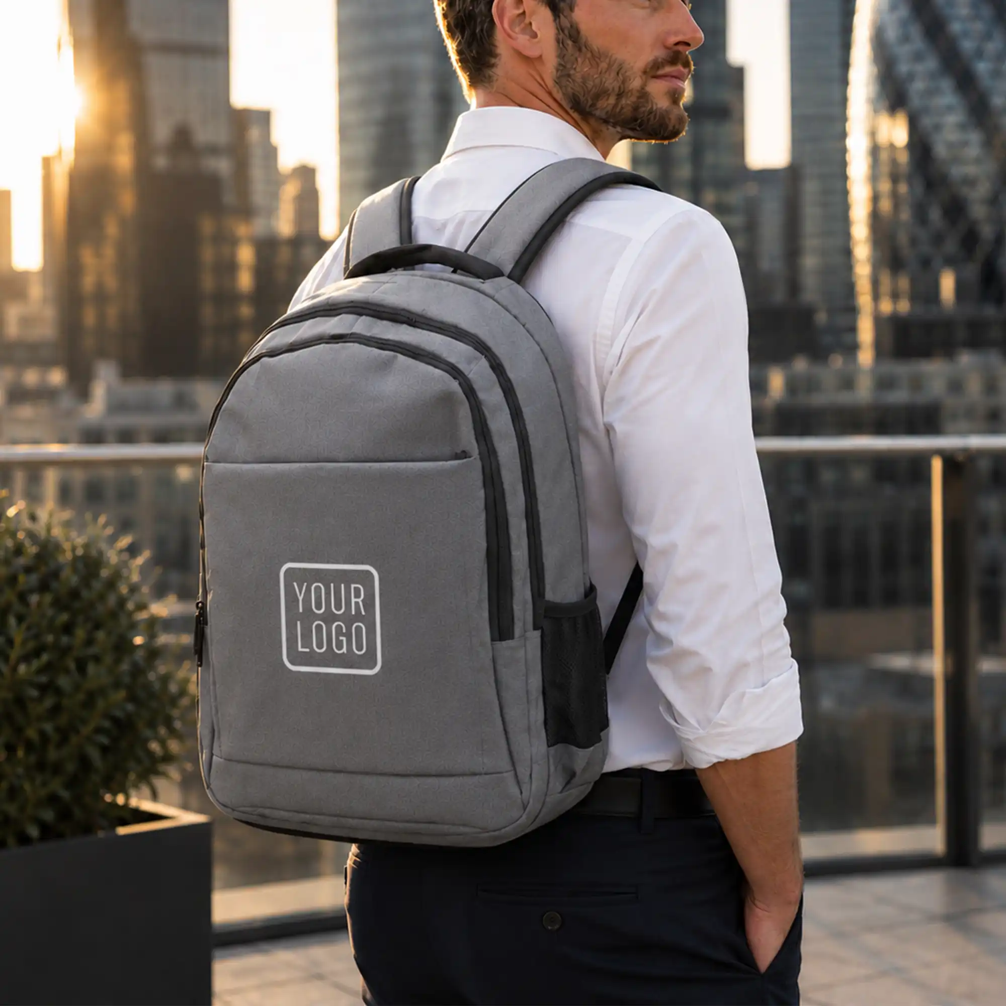 Gray travel backpack with zipper and USB charging feature