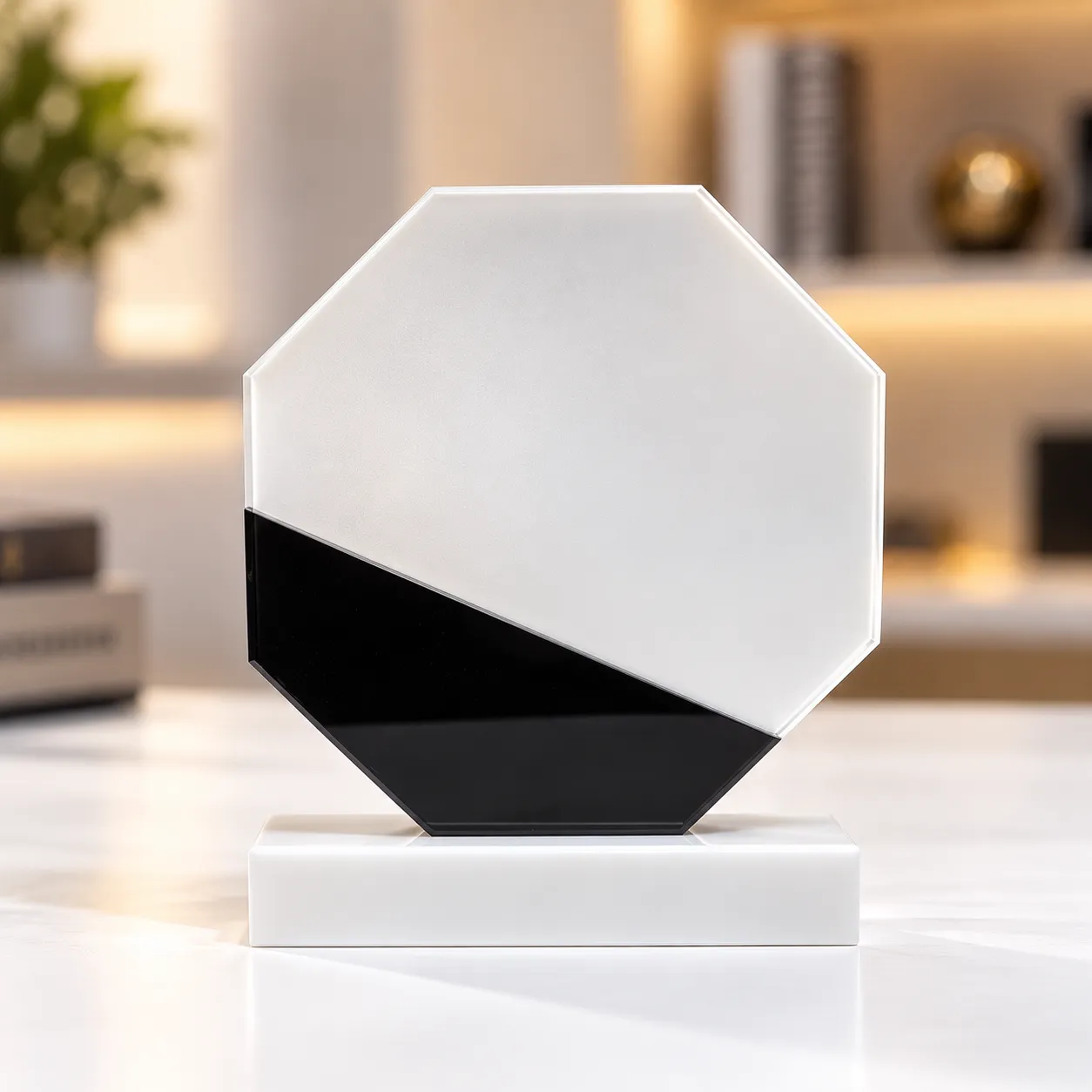 White marble octagonal crystal award on a desk