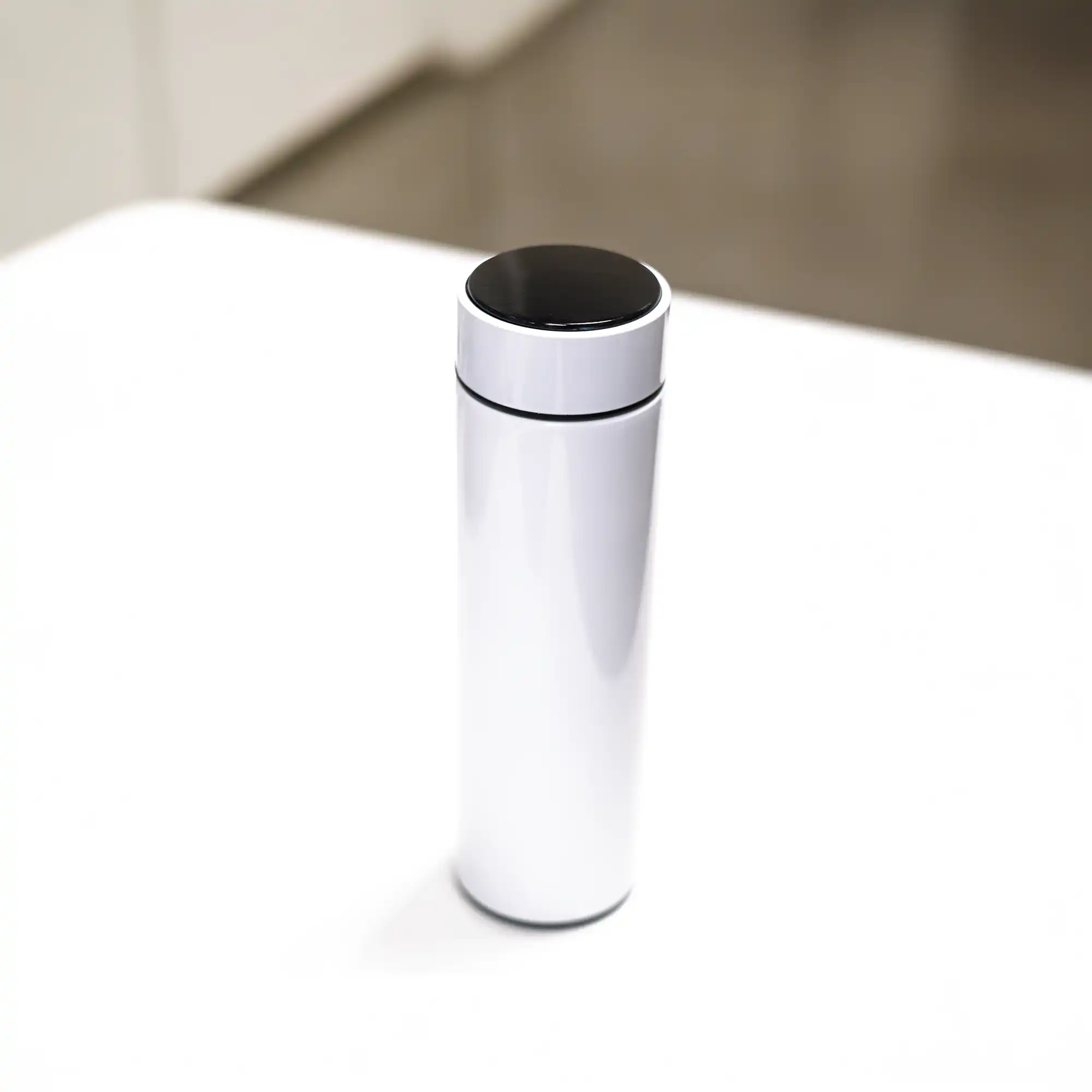 White smart insulated bottle with temperature display – side angle view on white background