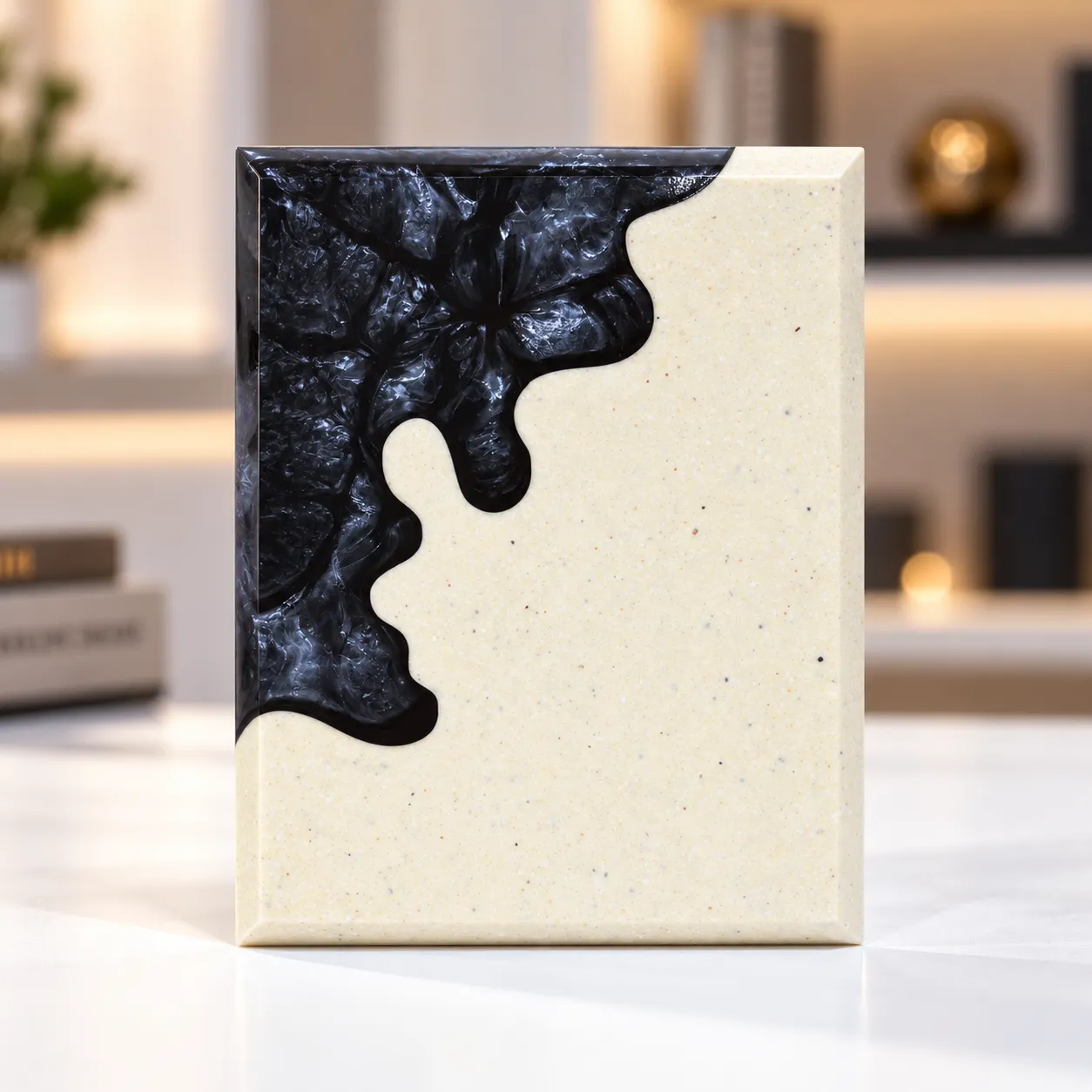 Black abstract crystal award with cream body on a desk