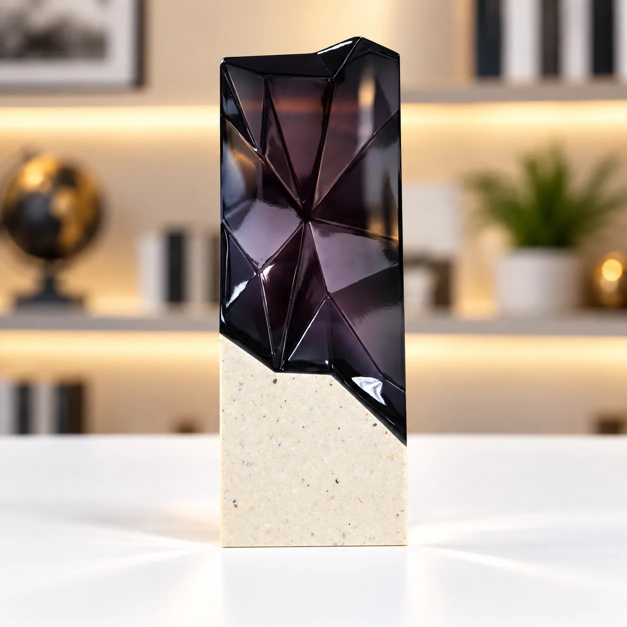 Black faceted prism crystal award on a cream base