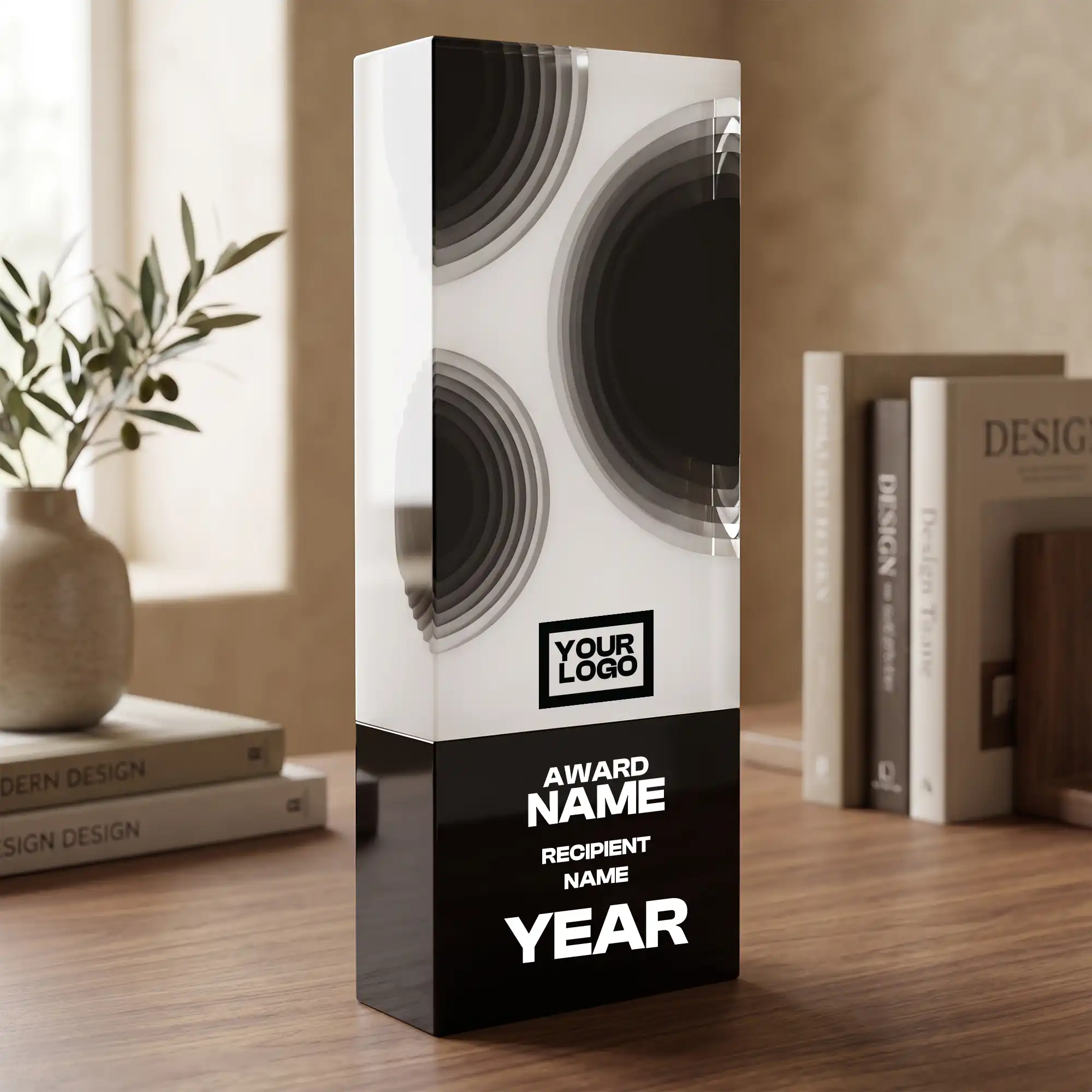Two-tone crystal award with black orbit circle motif on white face