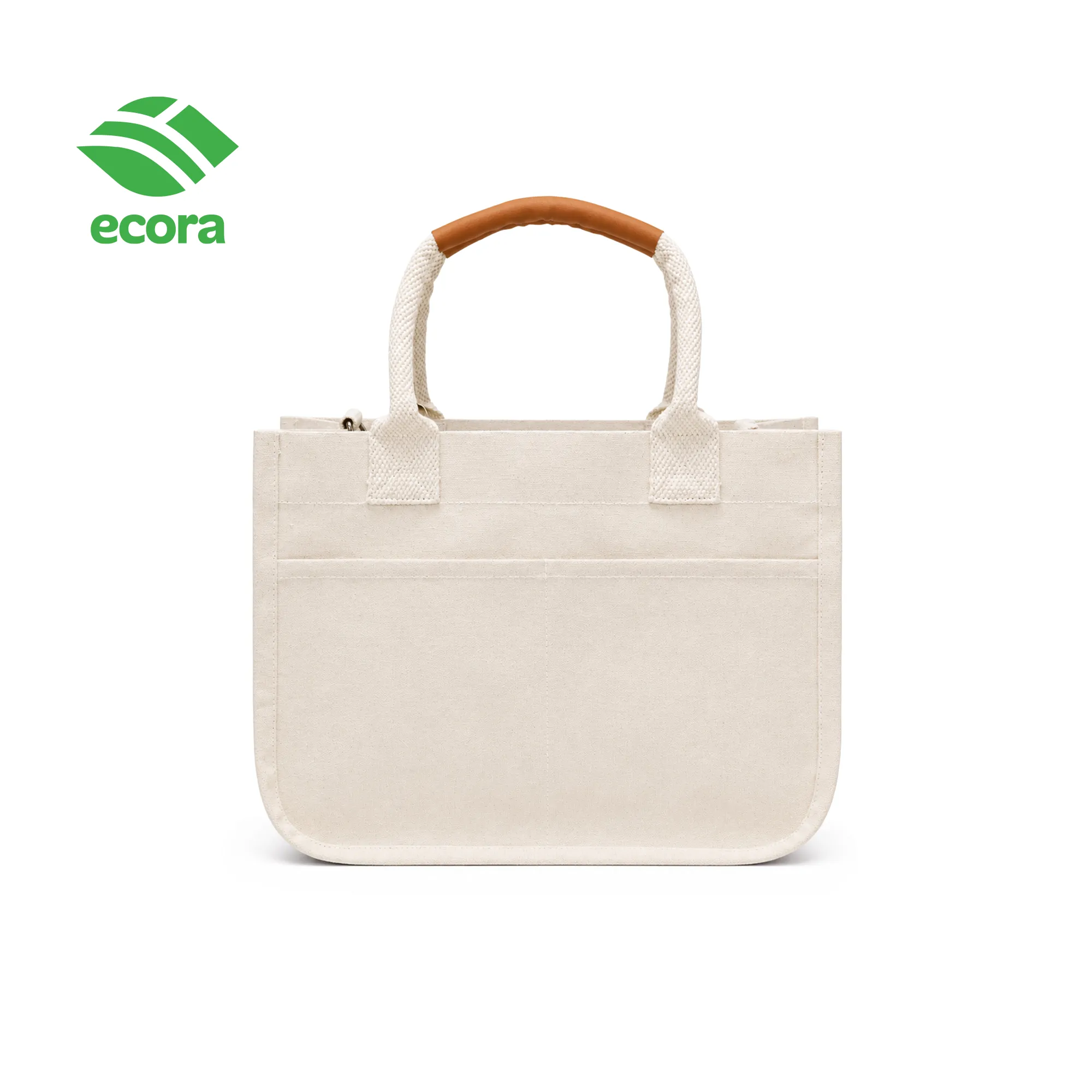 Canvo canvas tote carried by hand, shown in use at everyday scale
