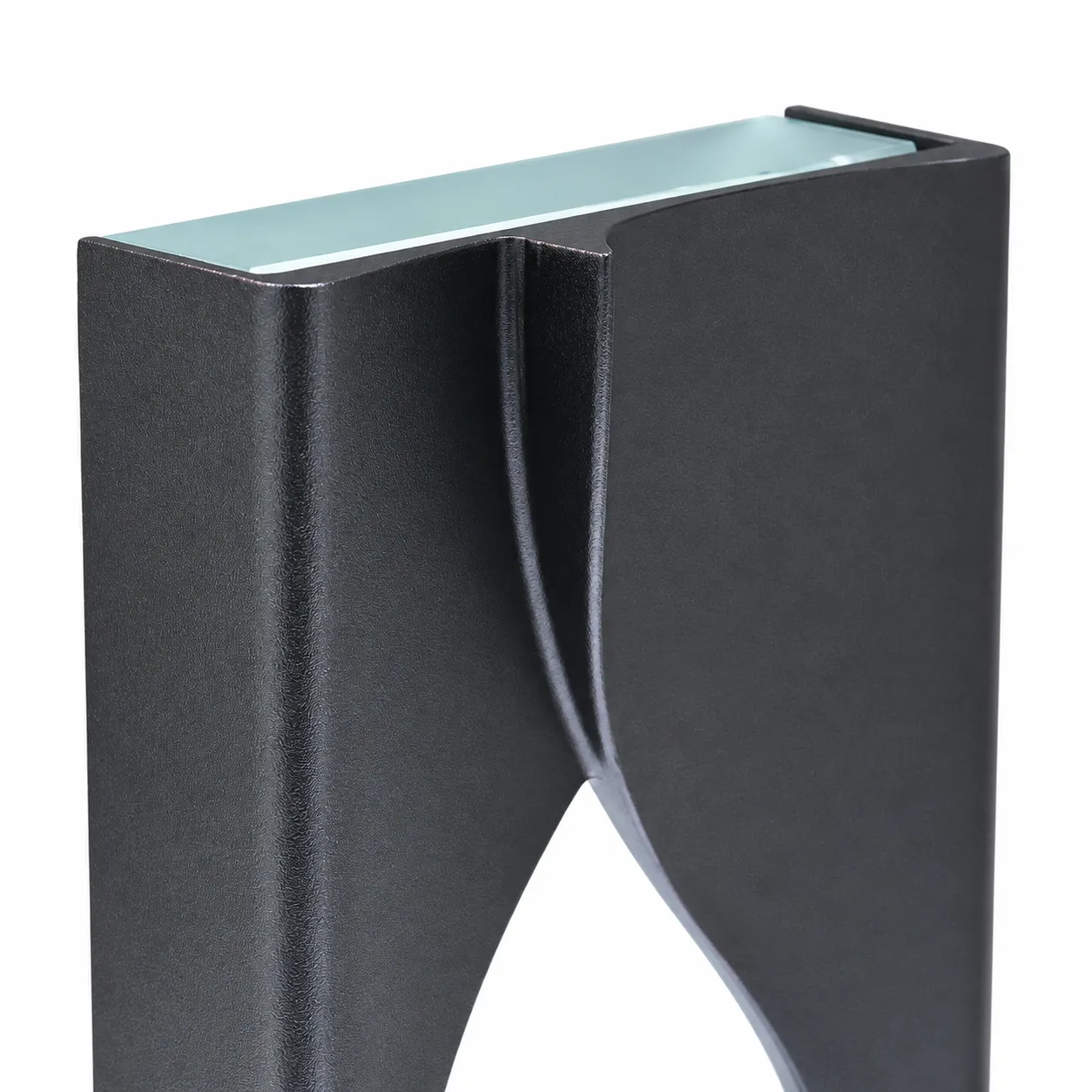 silver oval accent crystal award standing upright on a desk