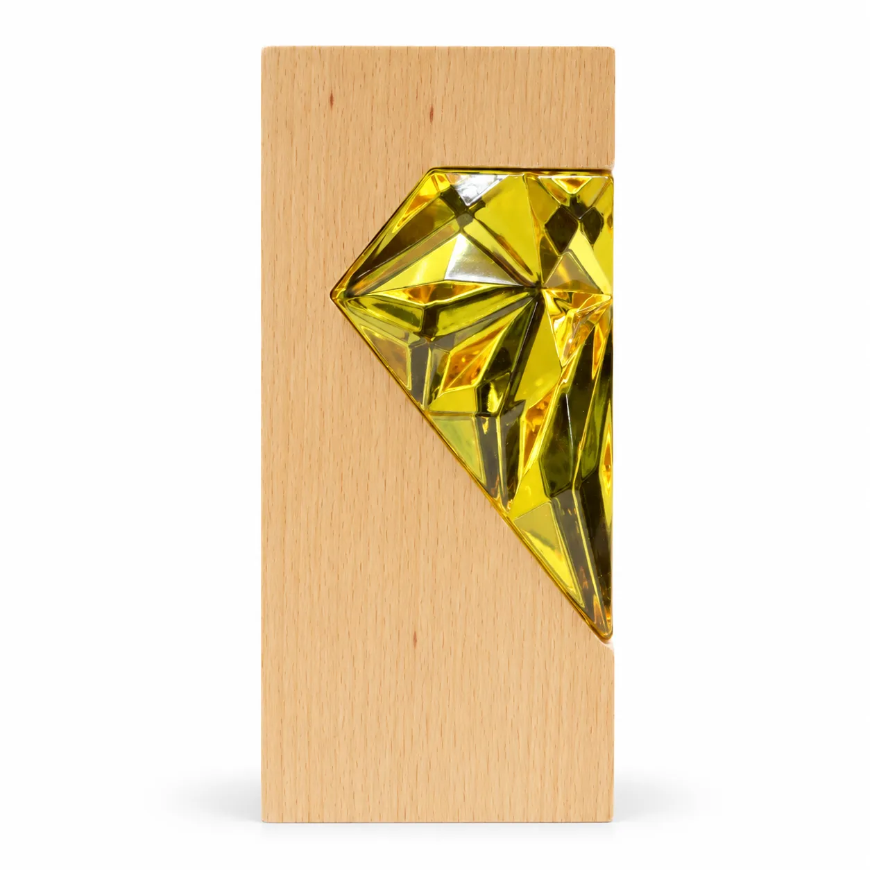 Gold crystal diamond award on wood base, close-up of faceted surface
