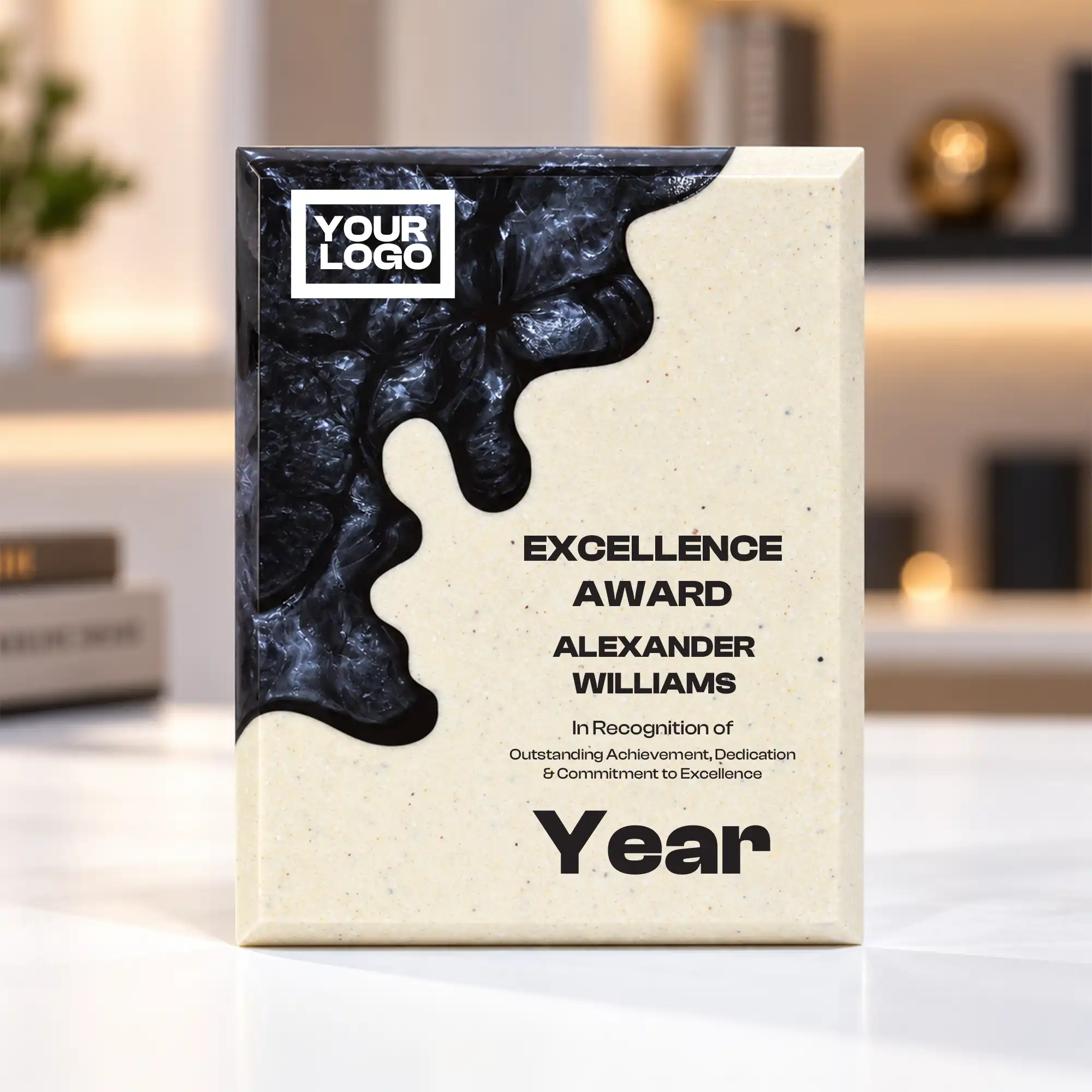 Black abstract crystal award with cream body on a desk
