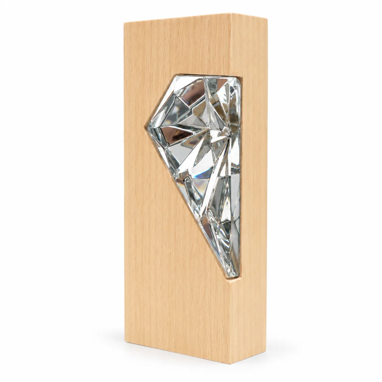 Silver crystal diamond award on wood base, close-up of faceted surface