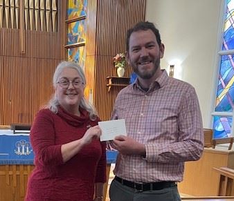 Stacie receiving a check for the chorus