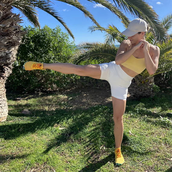 A girl exercising with Saguaro barefoot shoes