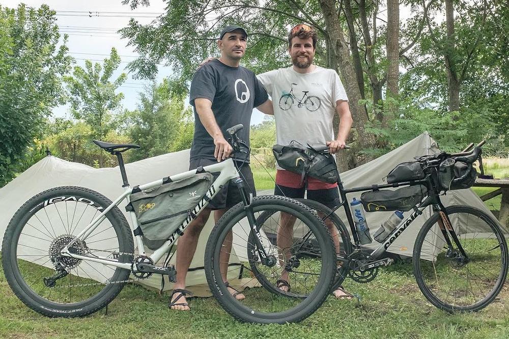 2 men with bicycles wearing Xero Z-Treks Barefoot Sandals