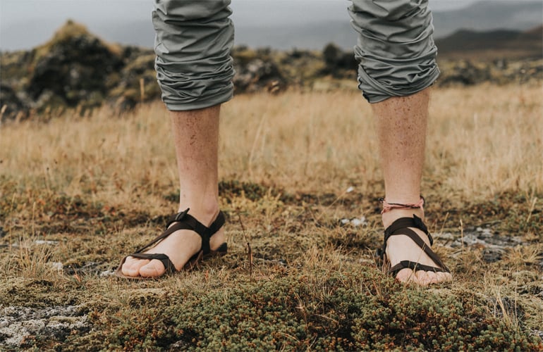 A man wearing Xero Z-Treks barefoot sandals