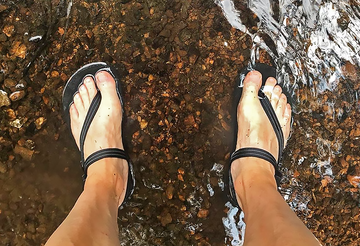 Legs wearing Elemental barefoot sandals