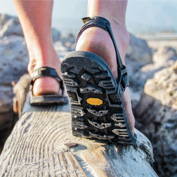 Legs wearing Middle Bear Winged barefoot shoes walking