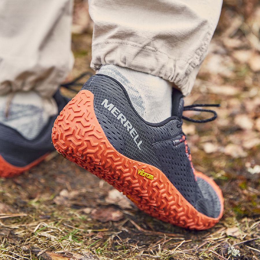 a leg wearing Merrell Vapor Glove 6 barefoot shoe