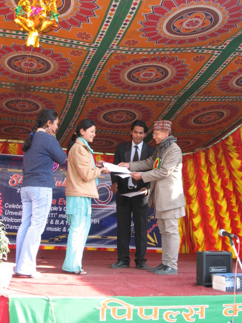 Certificate distribution by Rikesh Karna and the Campus Principal.